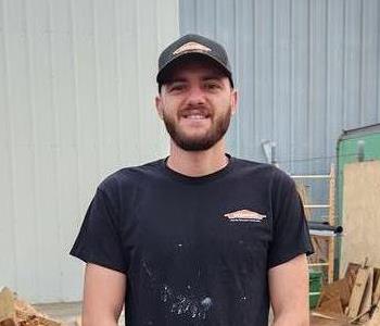 Employee standing in front of building